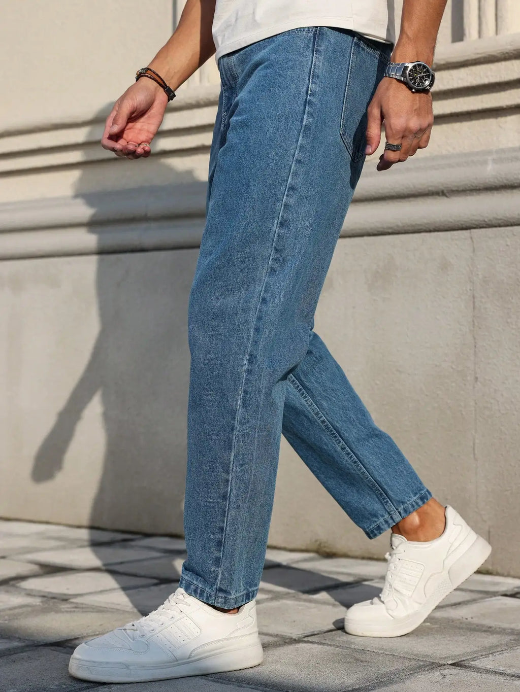 Men's jeans classic blue denim fabric with a loose fit,