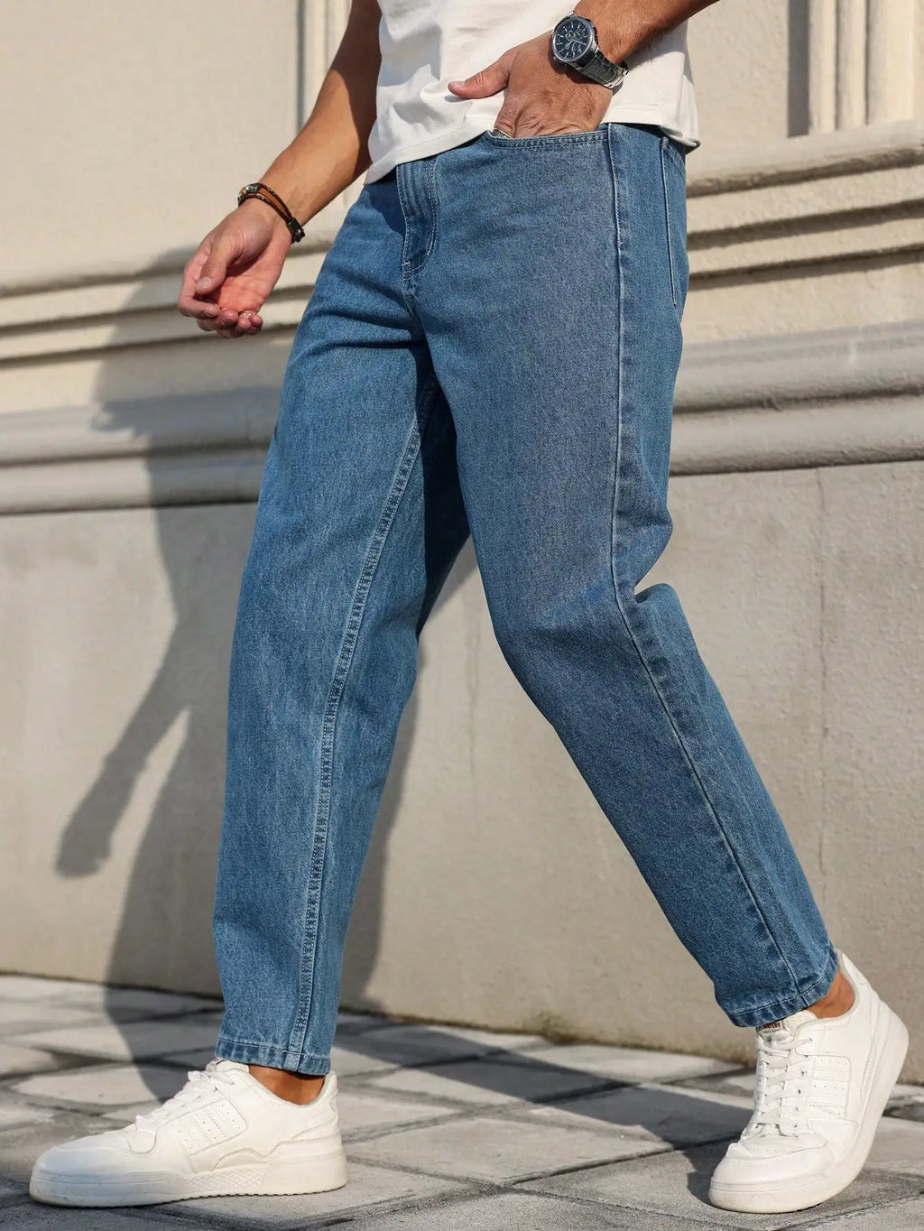 Men's jeans classic blue denim fabric with a loose fit,