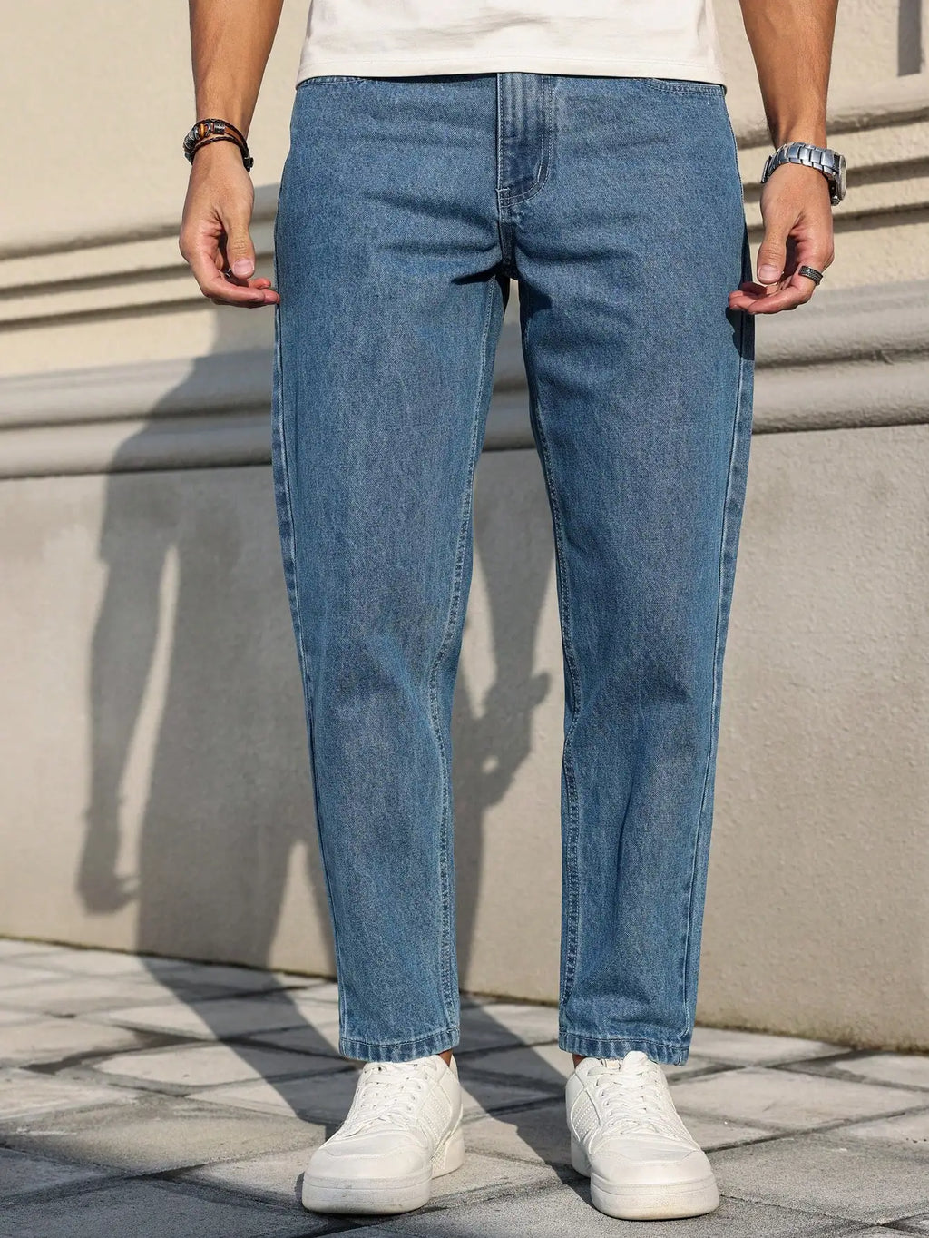 Men's jeans classic blue denim fabric with a loose fit,