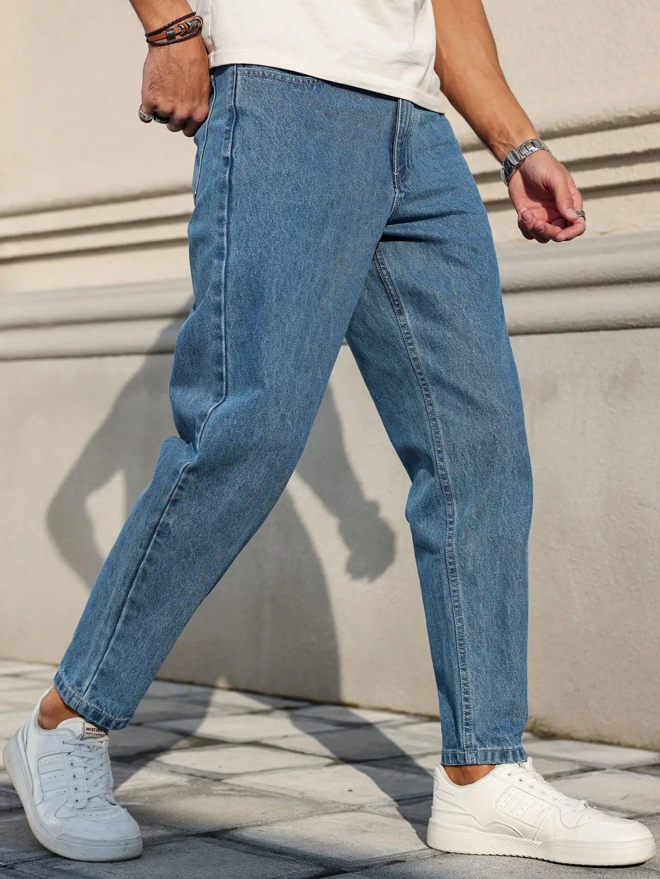 Men's jeans classic blue denim fabric with a loose fit,