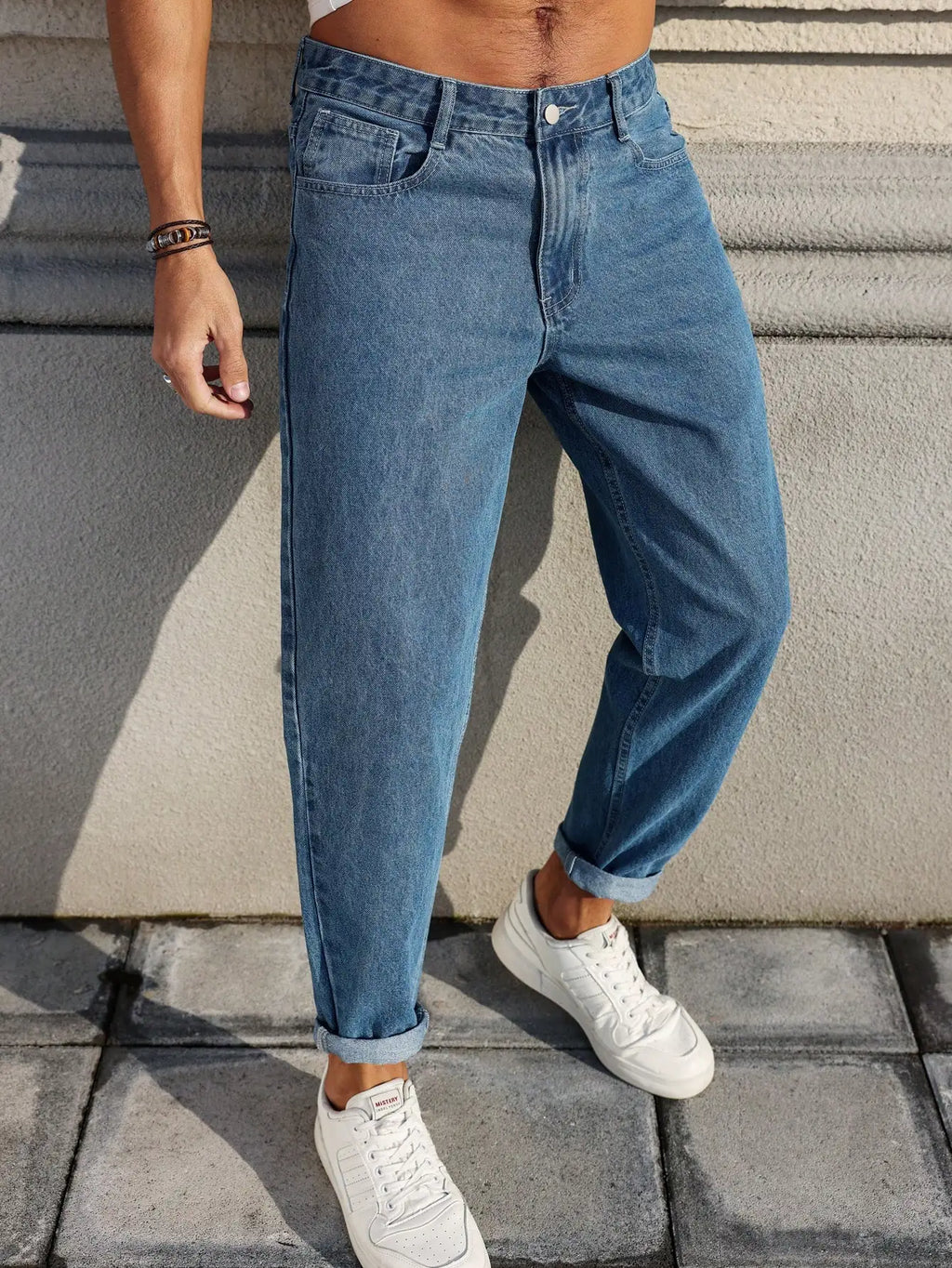 Men's jeans classic blue denim fabric with a loose fit,